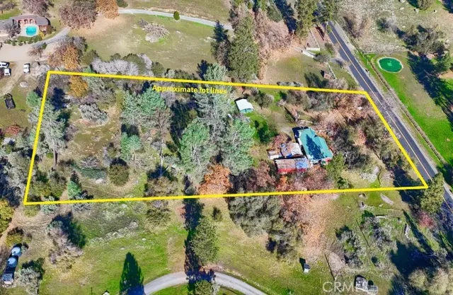 an aerial view of residential house and sandy dunes