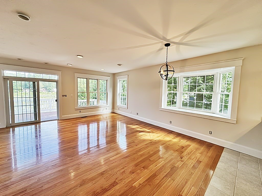 8 Dulcies Point Road Kingston, NH 03848 - Photo 11 of 27 a view of an empty room with wooden floor and a window