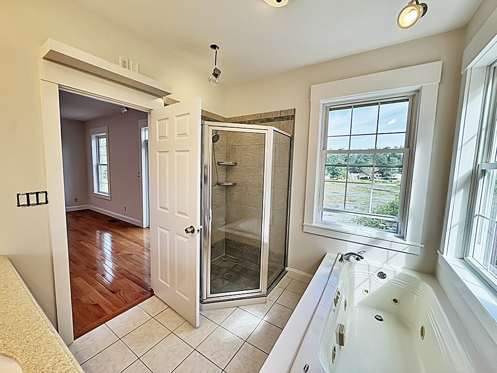 8 Dulcies Point Road Kingston, NH 03848 - Photo 18 of 27 a bathroom with a tub shower and sink