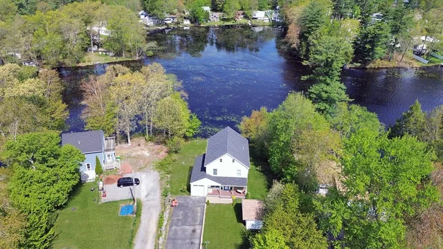 an aerial view of a house with outdoor space