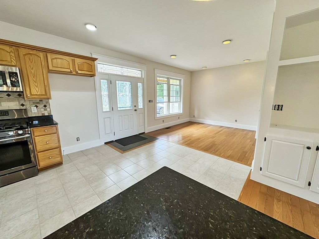 8 Dulcies Point Road Kingston, NH 03848 - Photo 9 of 27 a view of a kitchen with wooden floor and electronic appliances