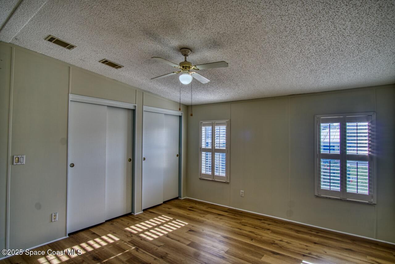 2390 Coconut Palm Drive Palm Bay, FL 32905 - Photo 12 of 27 a view of an empty room with a window