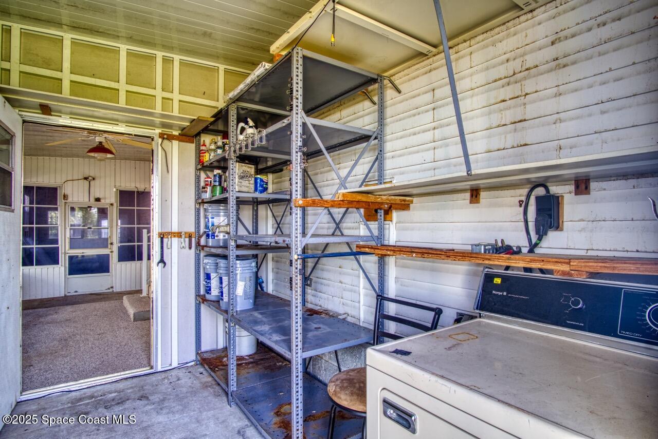 2390 Coconut Palm Drive Palm Bay, FL 32905 - Photo 20 of 27 a view of a storage room with wooden floor