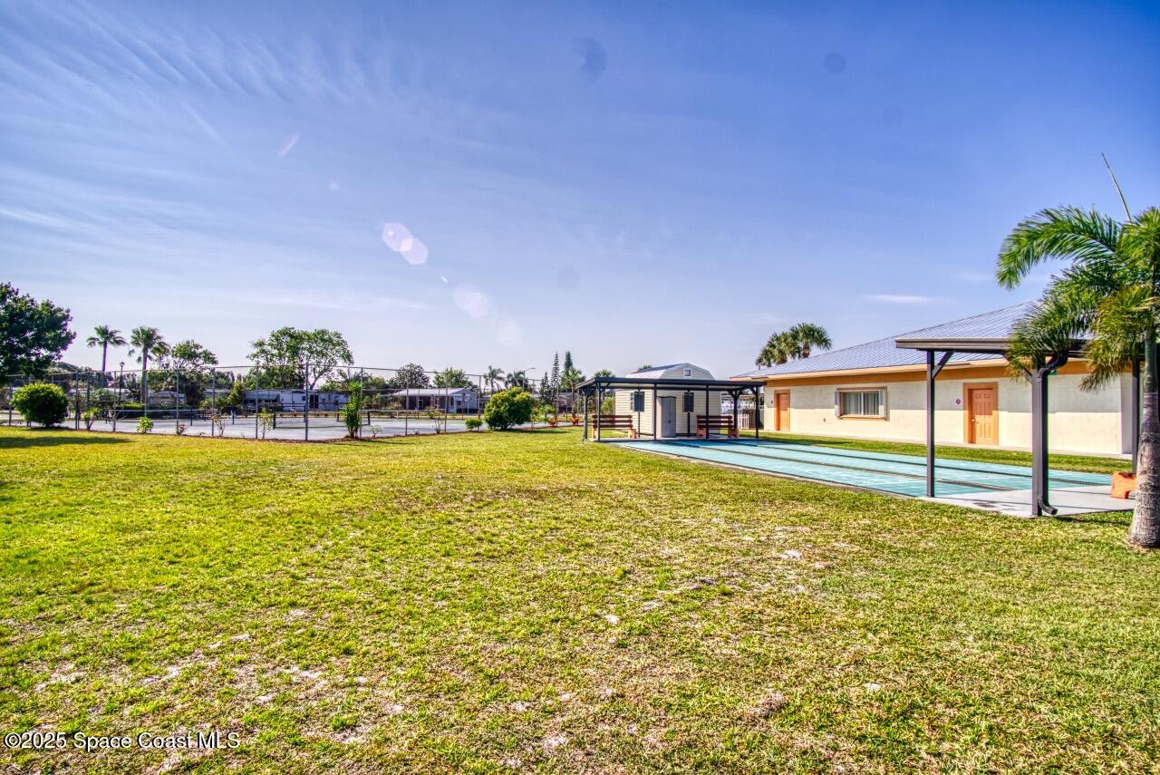 2390 Coconut Palm Drive Palm Bay, FL 32905 - Photo 23 of 27 a view of an ocean of house with outdoor space
