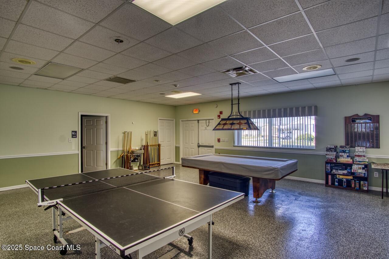 2390 Coconut Palm Drive Palm Bay, FL 32905 - Photo 25 of 27 a room with pool table table soccer and windows