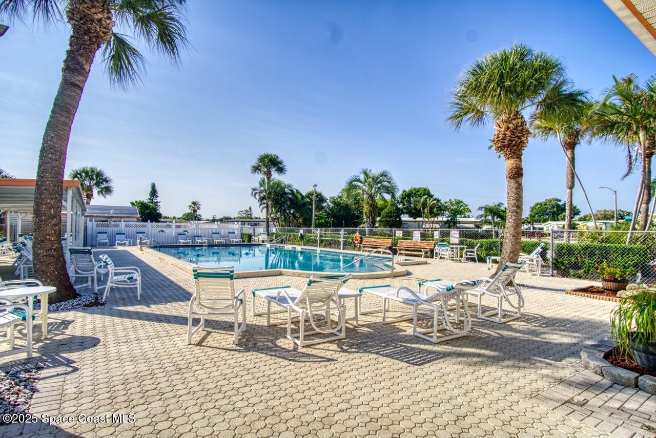 2390 Coconut Palm Drive Palm Bay, FL 32905 - Photo 26 of 27 a view of a swimming pool with a patio