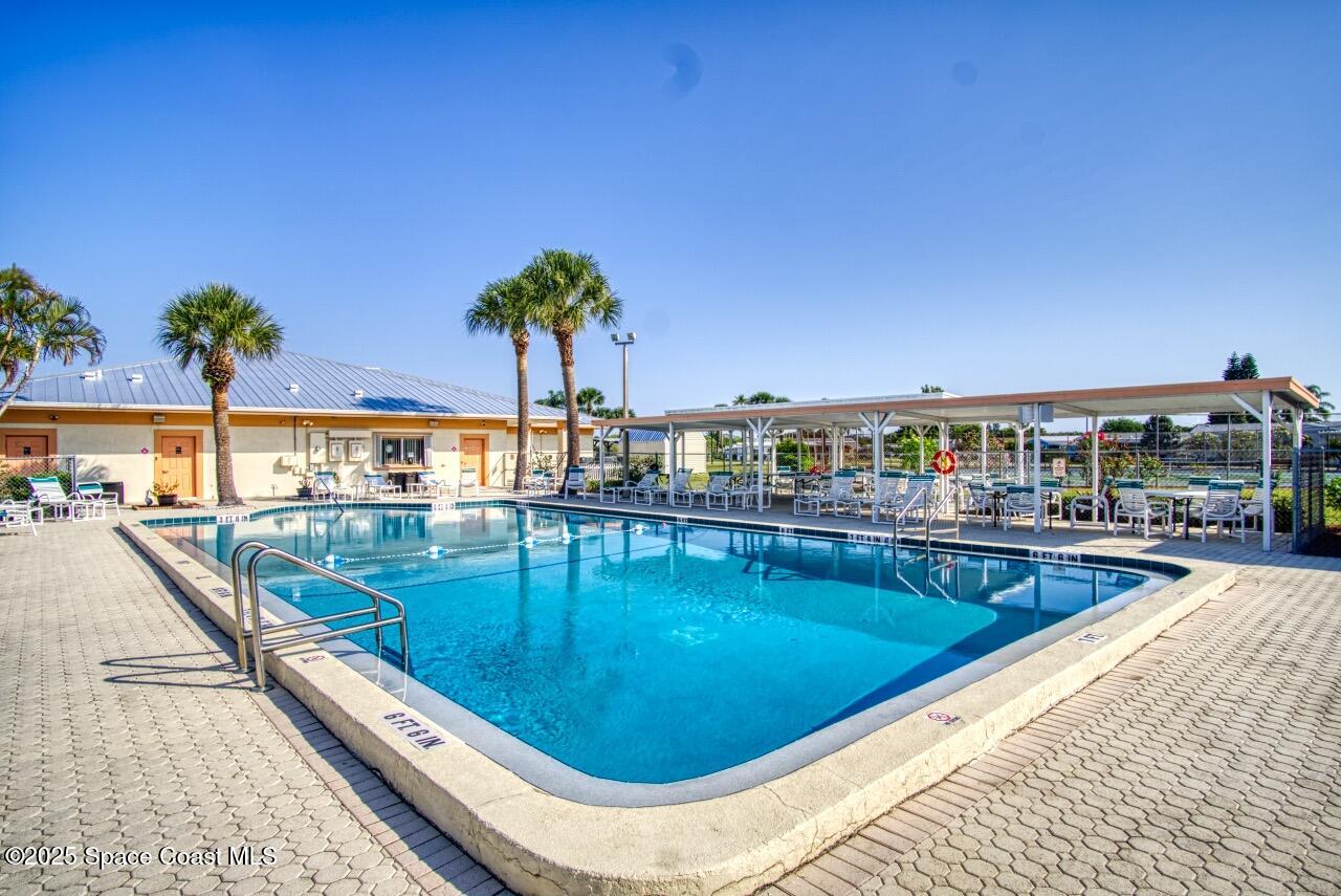 2390 Coconut Palm Drive Palm Bay, FL 32905 - Photo 27 of 27 a view of swimming pool with outdoor seating