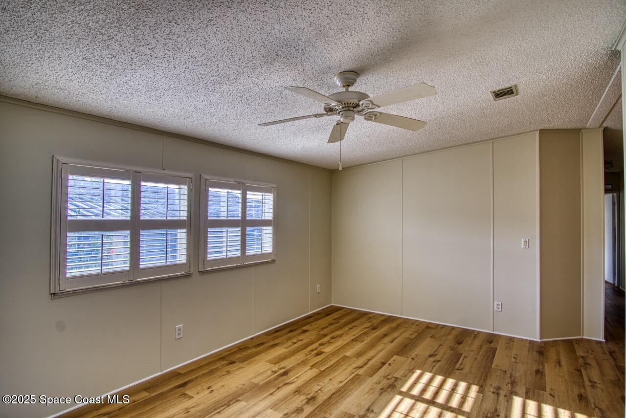 2390 Coconut Palm Drive Palm Bay, FL 32905 - Photo 5 of 27 a view of an empty room with a window