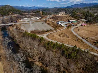 a view of a town with mountains in the background