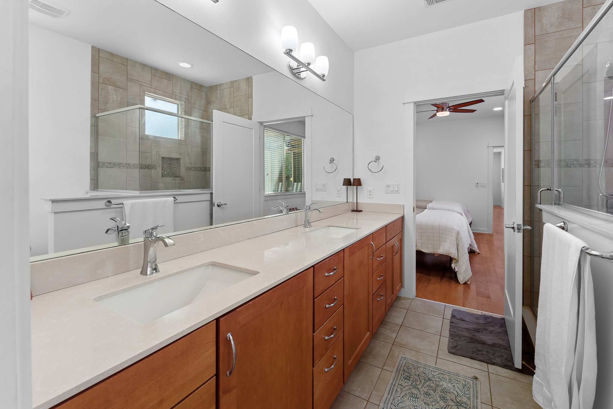 4408 Banister Lane, Unit B Austin, TX 78745 - Photo 18 of 28 a bathroom with a double vanity sink and a mirror