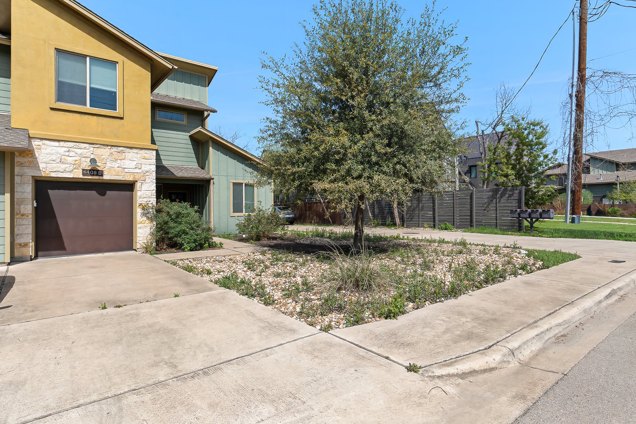 4408 Banister Lane, Unit B Austin, TX 78745 - Photo 3 of 28 a front view of a house with a yard