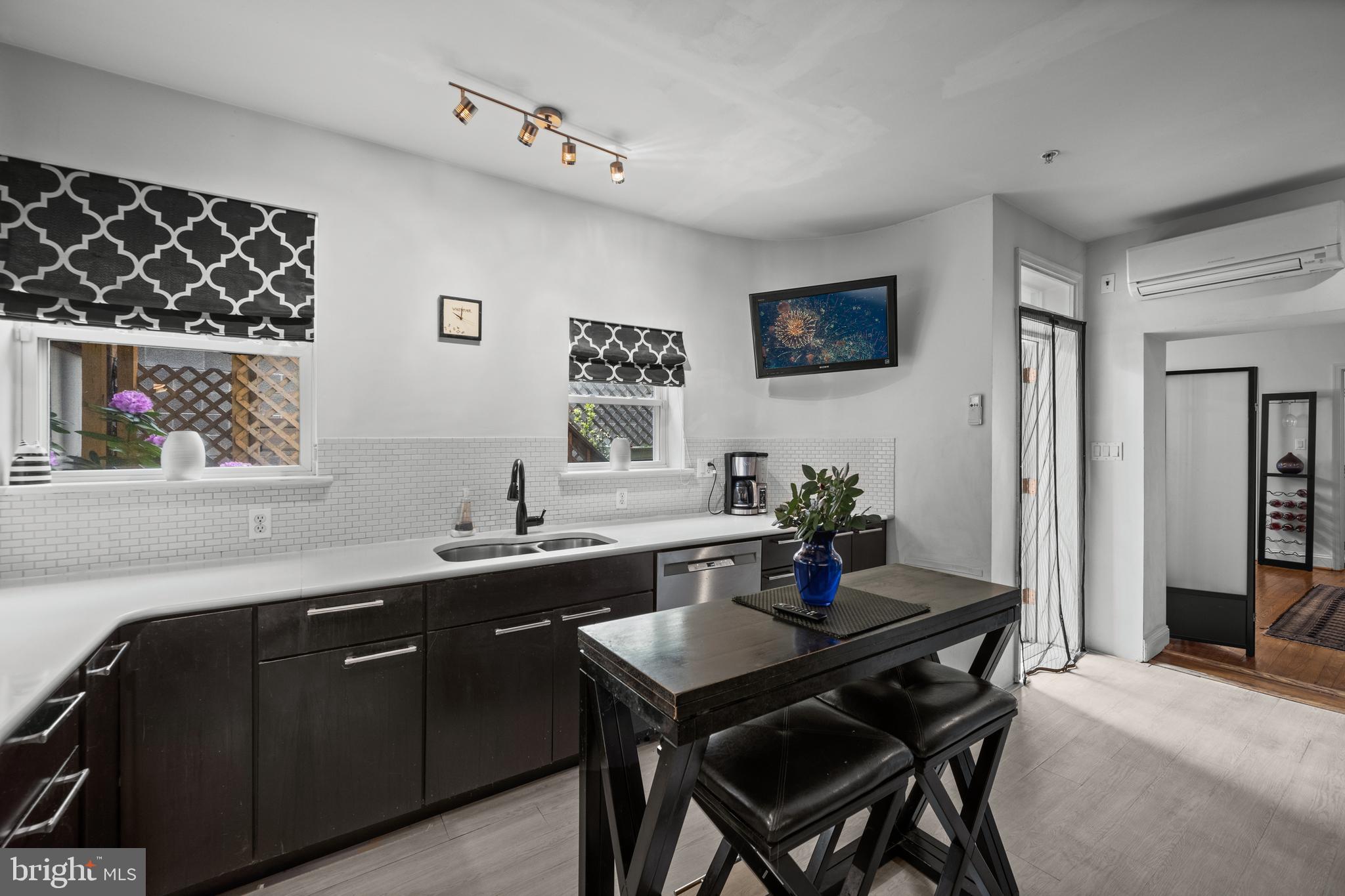 210 South High Street Baltimore, MD 21202 - Photo 19 of 80 a kitchen with a table and chairs in it