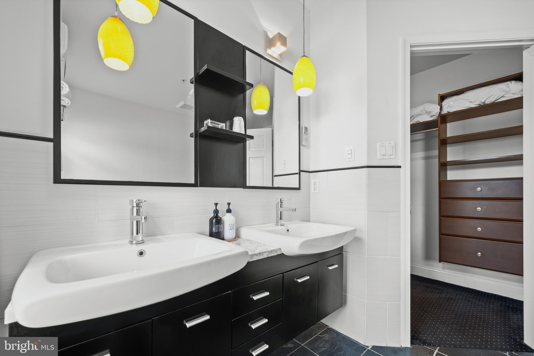 210 South High Street Baltimore, MD 21202 - Photo 30 of 80 a bathroom with a sink and a mirror