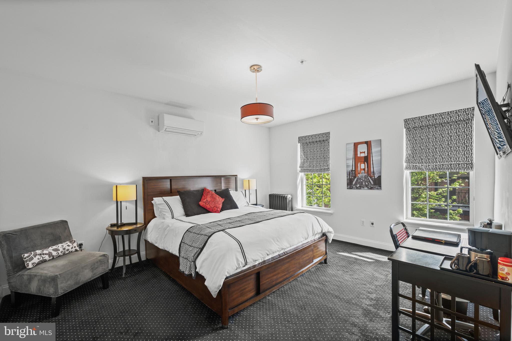 210 South High Street Baltimore, MD 21202 - Photo 33 of 80 a bedroom with a bed and a window