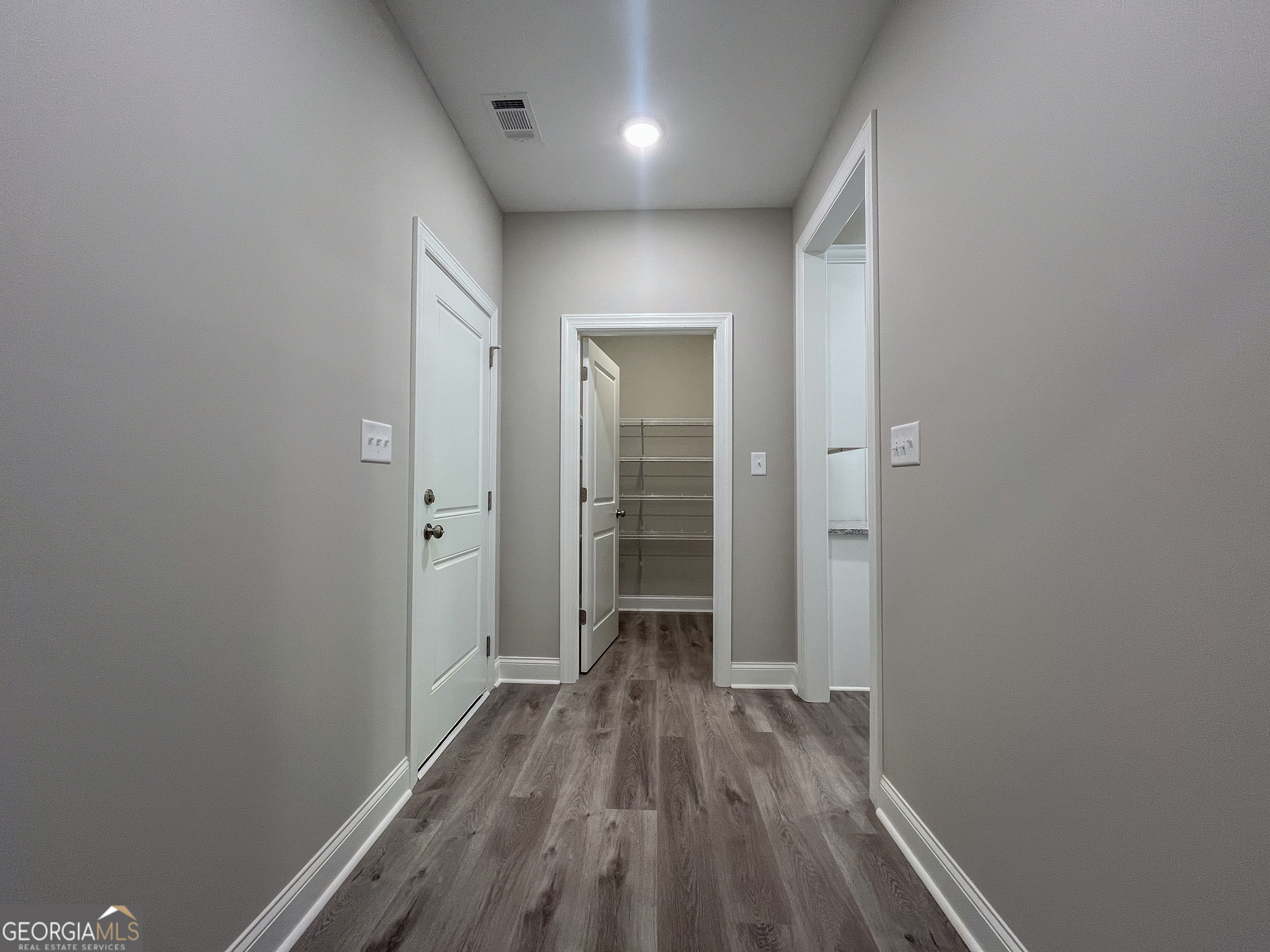 711 Flanders Lane Dublin, GA 31021 - Photo 17 of 49 a view of hallway with wooden floor