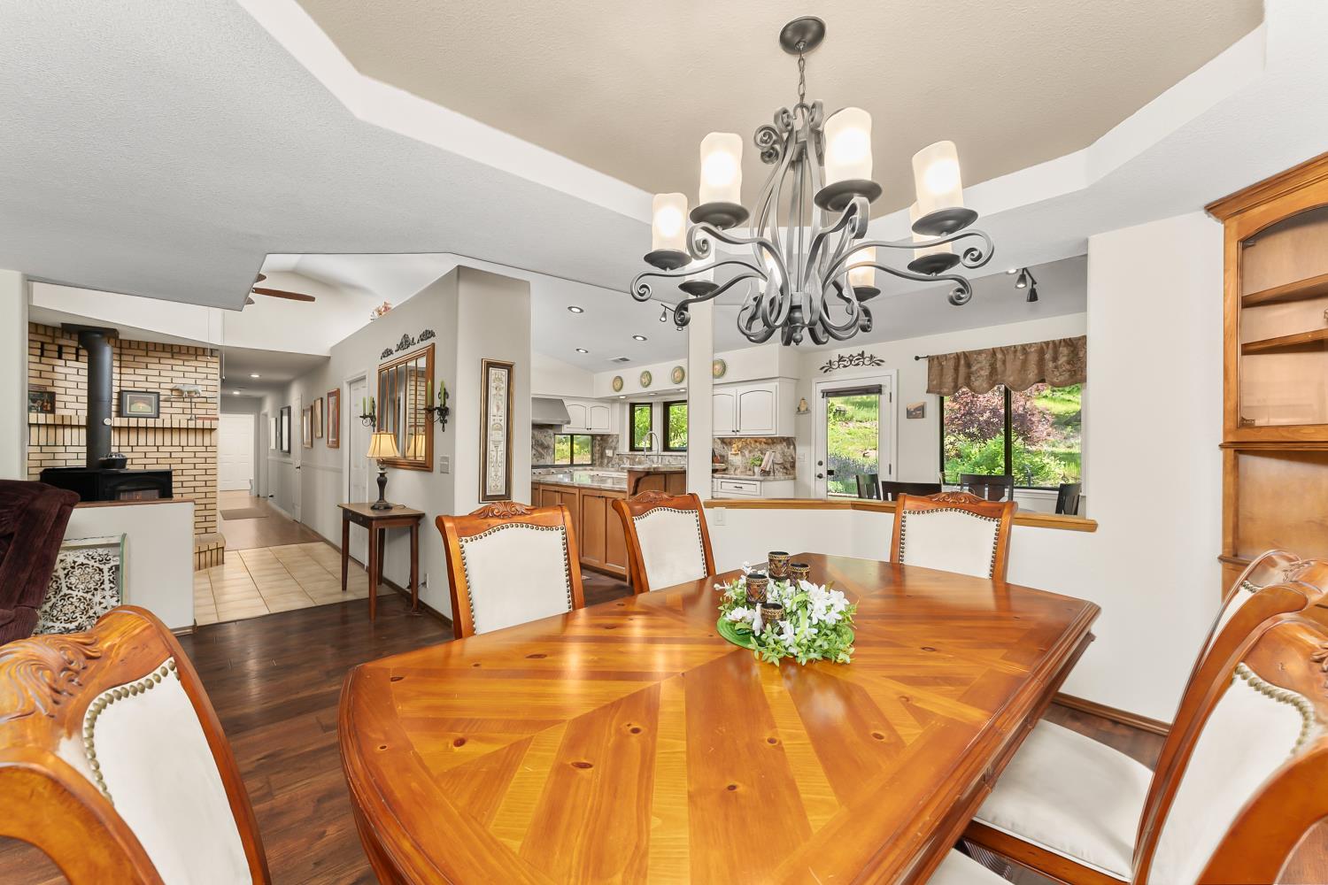 19461 Fiddletown Road Fiddletown, CA 95629 - Photo 14 of 62 a view of a dining room with furniture wooden floor and chandelier