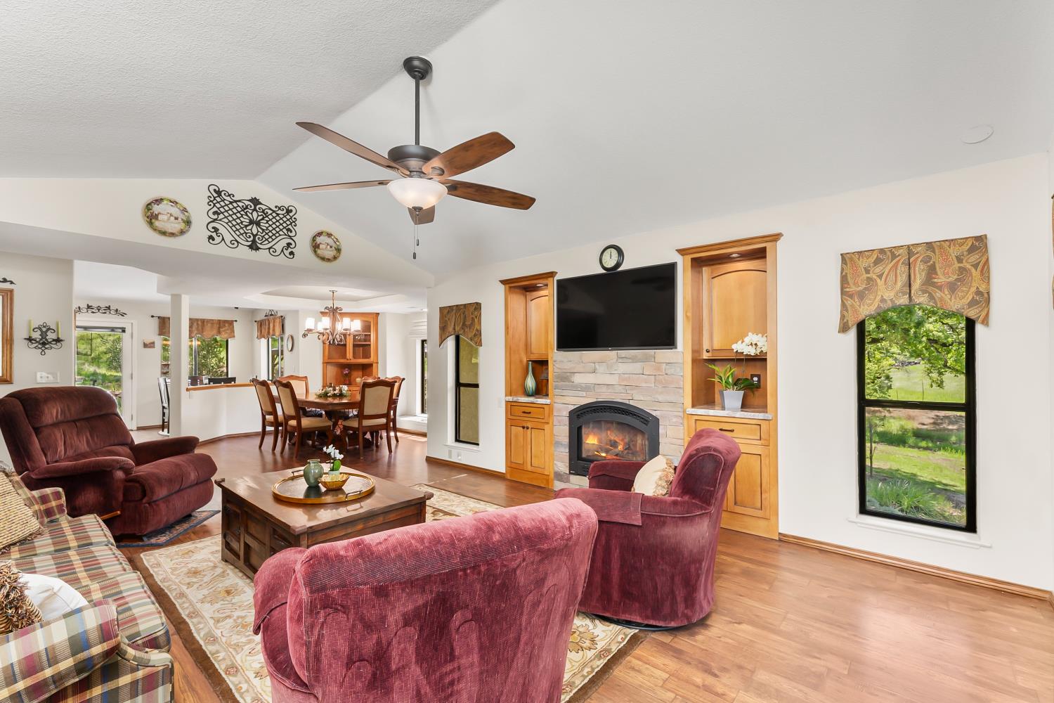 19461 Fiddletown Road Fiddletown, CA 95629 - Photo 16 of 62 a living room with furniture a fireplace and a large window