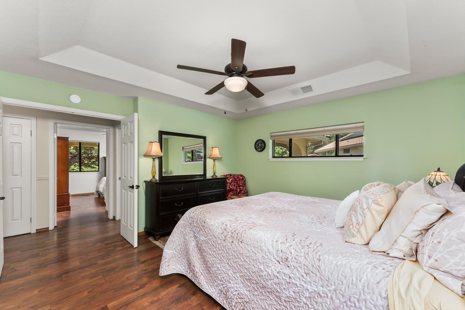 19461 Fiddletown Road Fiddletown, CA 95629 - Photo 19 of 62 a bedroom with a bed and wooden floor
