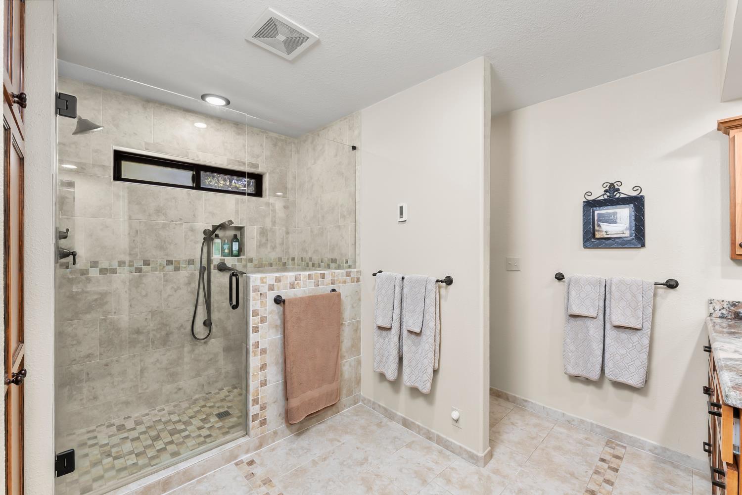 19461 Fiddletown Road Fiddletown, CA 95629 - Photo 21 of 62 a bathroom with a shower and a mirror