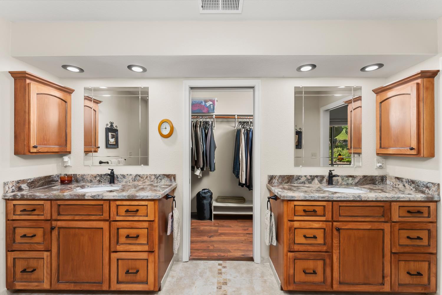 19461 Fiddletown Road Fiddletown, CA 95629 - Photo 22 of 62 a bathroom with a granite countertop double vanity sink and mirror