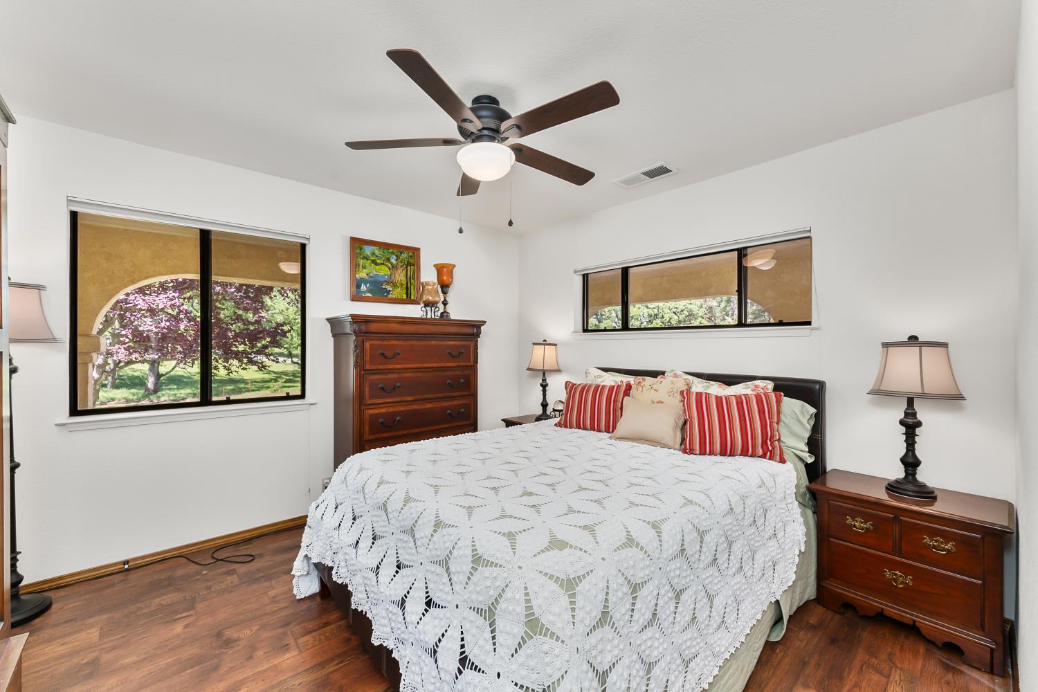 19461 Fiddletown Road Fiddletown, CA 95629 - Photo 24 of 62 a bedroom with a bed and wooden floor