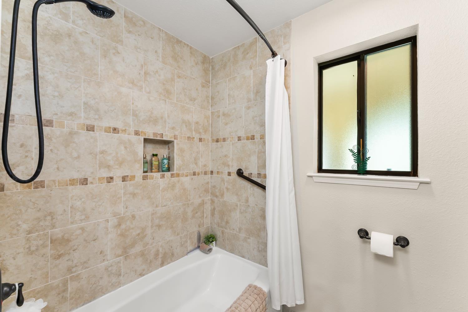 19461 Fiddletown Road Fiddletown, CA 95629 - Photo 26 of 62 a bathroom with a bathtub and a shower
