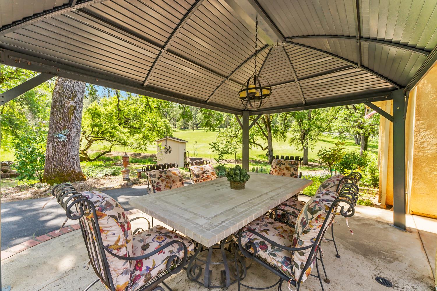 19461 Fiddletown Road Fiddletown, CA 95629 - Photo 29 of 62 a view of an outdoor dining space with furniture