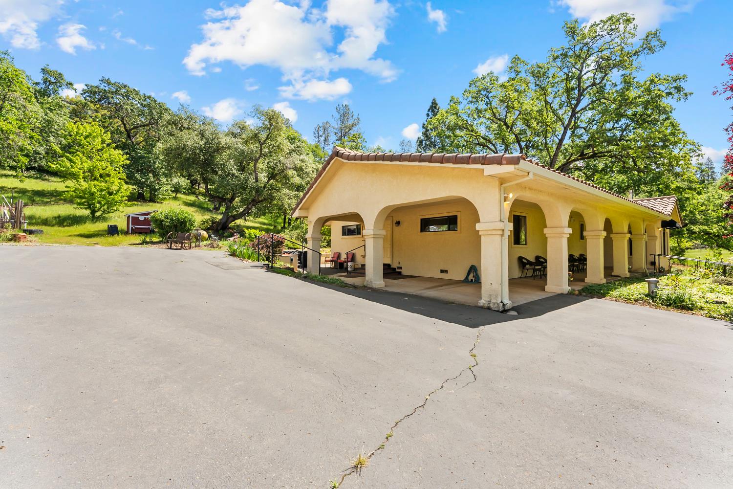 19461 Fiddletown Road Fiddletown, CA 95629 - Photo 33 of 62 a view of a white house with a big yard and large trees