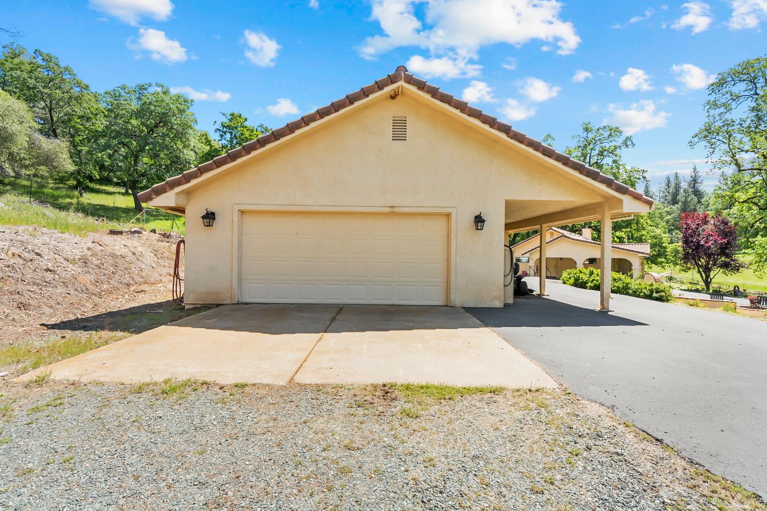 19461 Fiddletown Road Fiddletown, CA 95629 - Photo 40 of 62 a view of a white house with a street