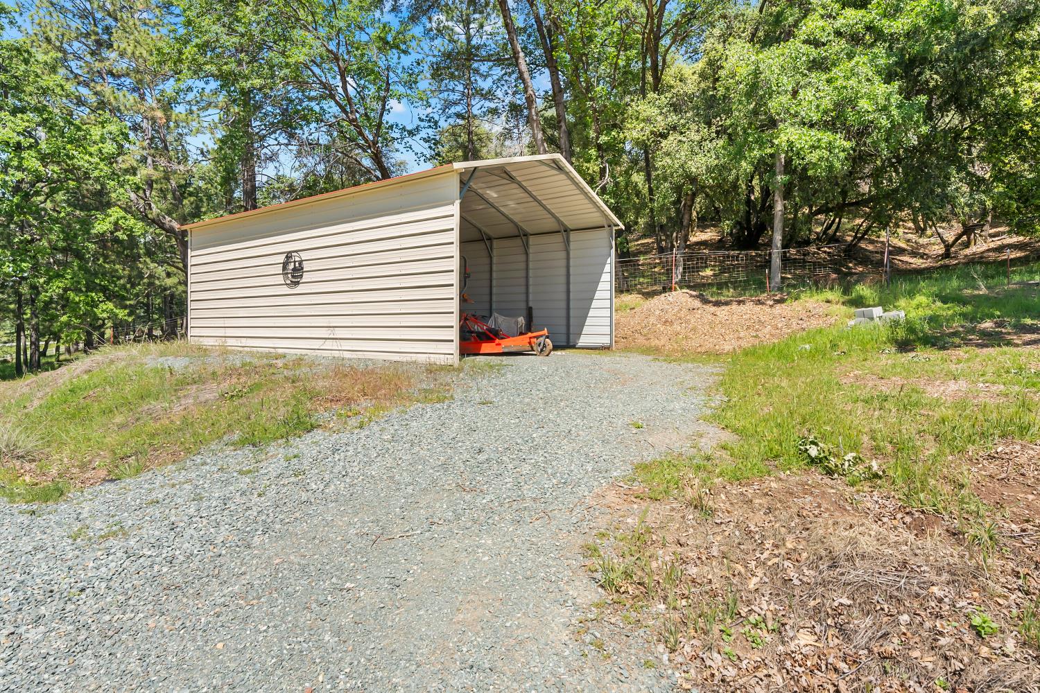 19461 Fiddletown Road Fiddletown, CA 95629 - Photo 45 of 62 a view of a house with backyard and trees