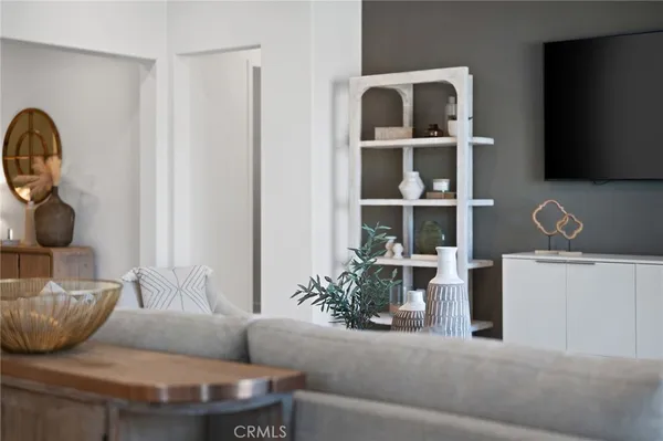 a kitchen with a stove and white cabinets