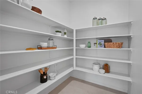 a bedroom with a bed and a lamp