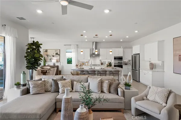 a kitchen with stainless steel appliances kitchen island granite countertop a sink and cabinets