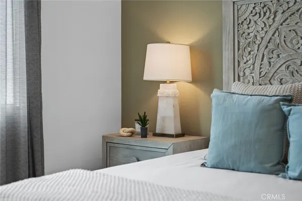 a bathroom with a granite countertop sink a toilet a mirror and shower