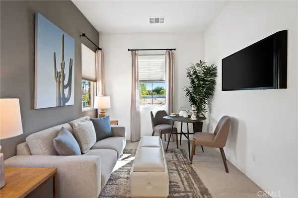 a bedroom with a bed and a mirror