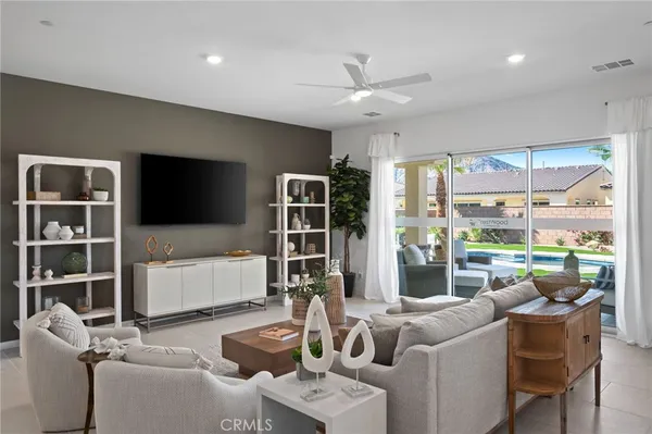 a kitchen with stainless steel appliances granite countertop a stove a sink and a white cabinets