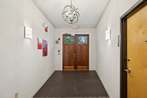 an aerial view of a house with a yard and garden