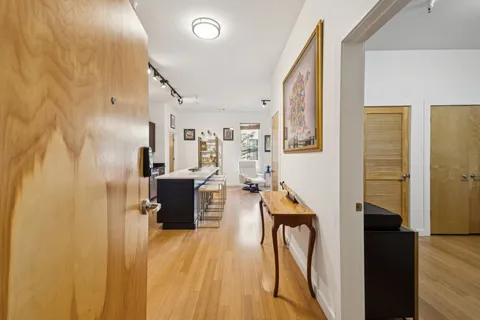 a view of a living room with a wooden floor
