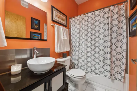 a kitchen with stainless steel appliances a stove refrigerator sink and microwave