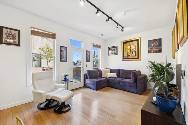 a view of a livingroom with furniture and a flat screen tv