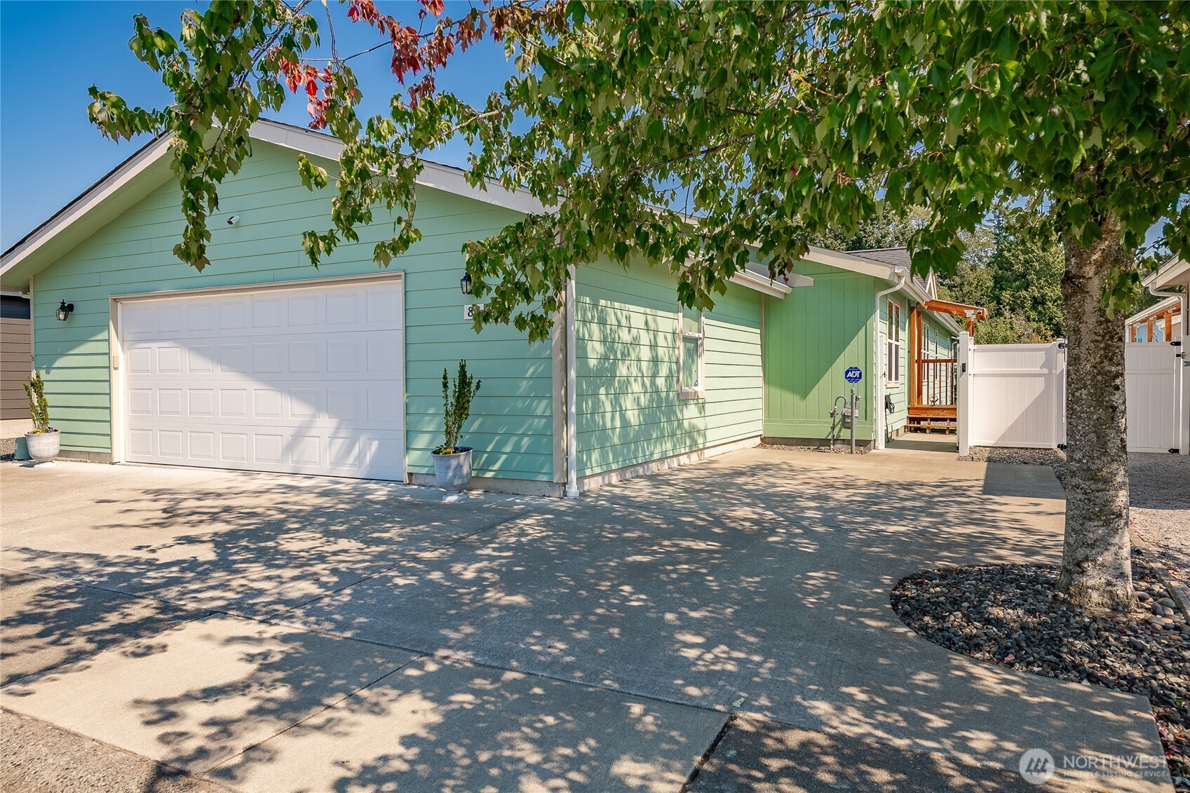a view of a house with a tree