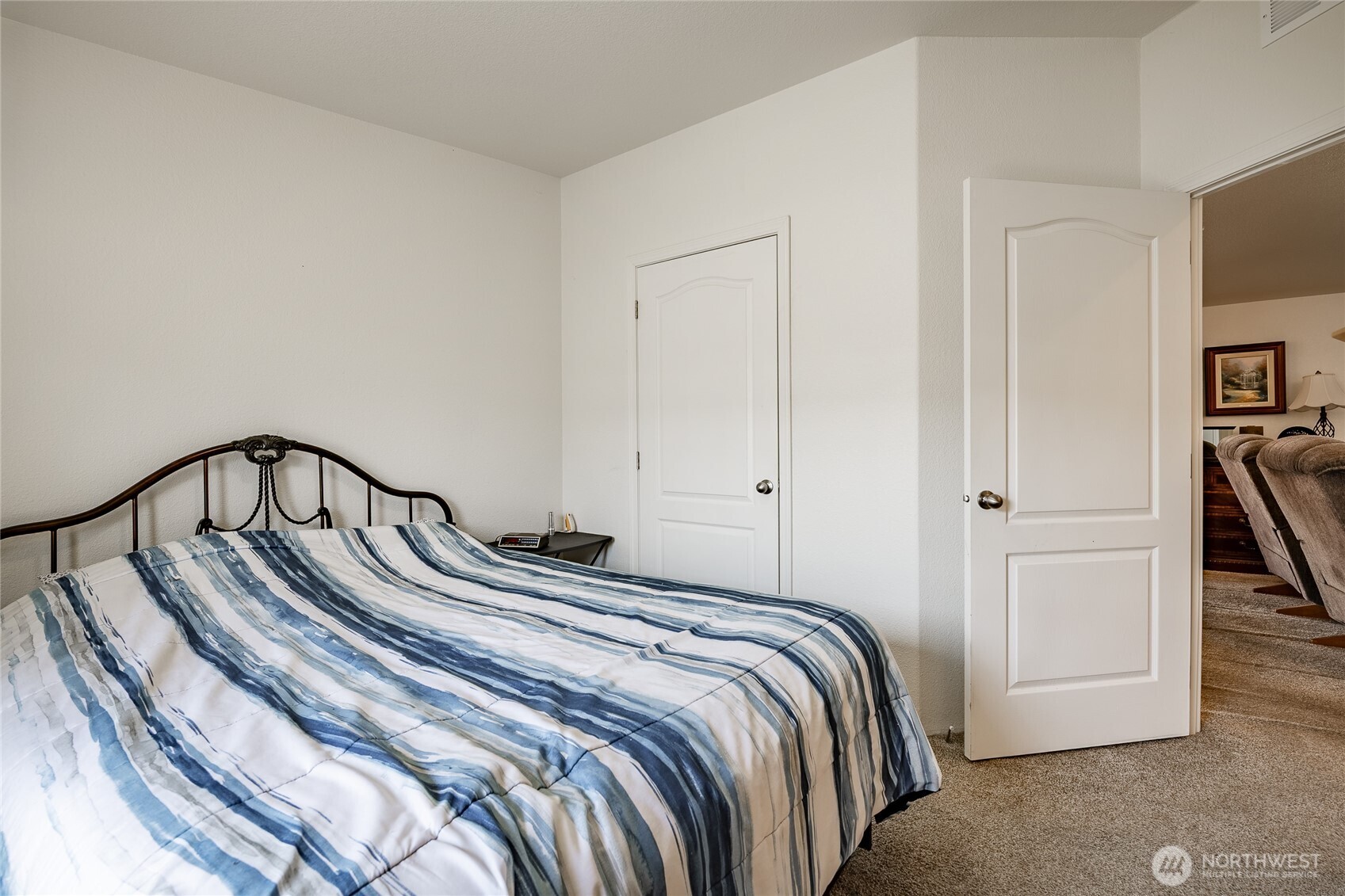 6350 Portal Way, Unit 83 Ferndale, WA 98248 - Photo 19 of 40 a bedroom with a bed and a dresser