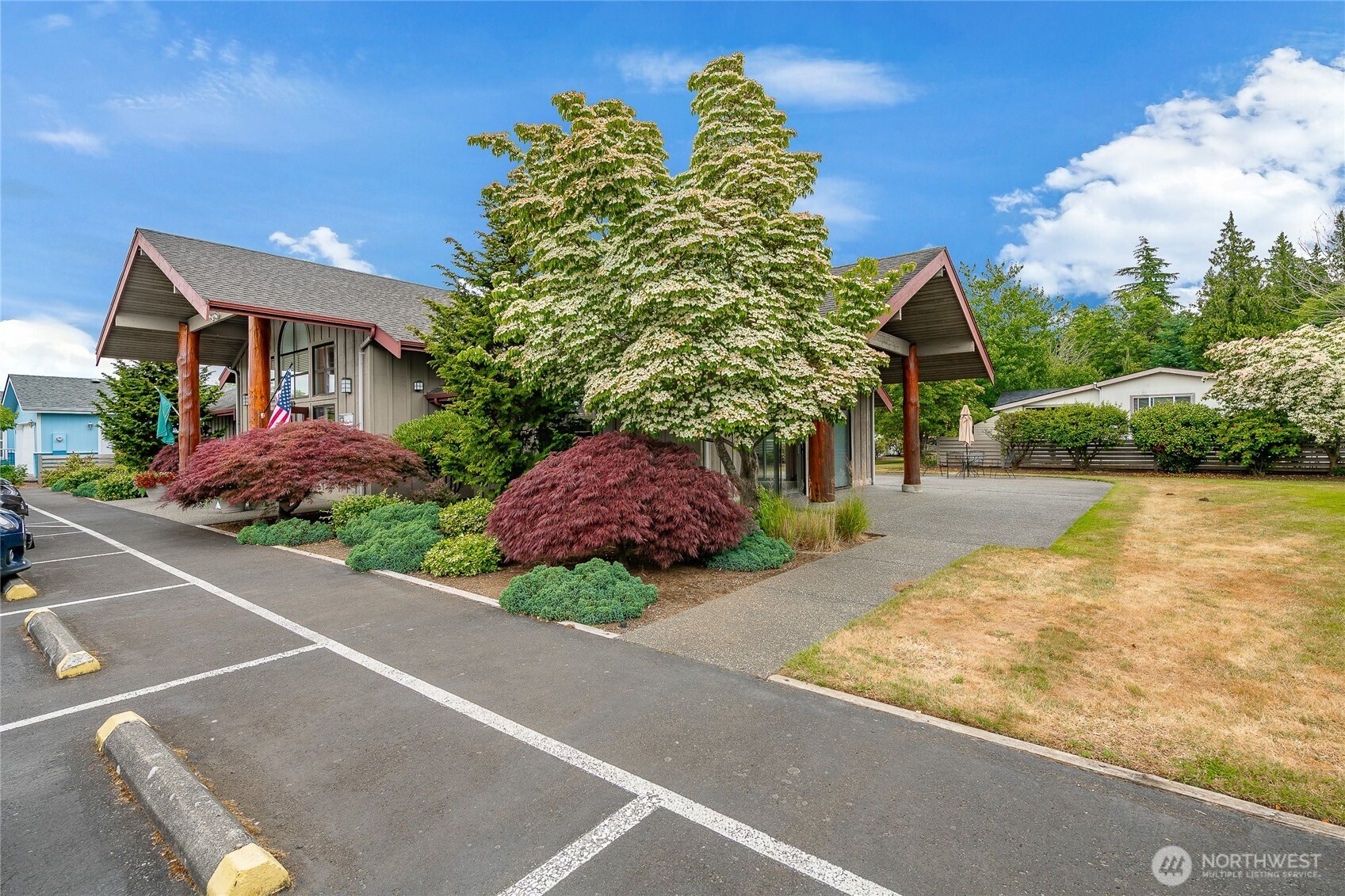 6350 Portal Way, Unit 83 Ferndale, WA 98248 - Photo 34 of 40 a view of a house with pool plants and next to road