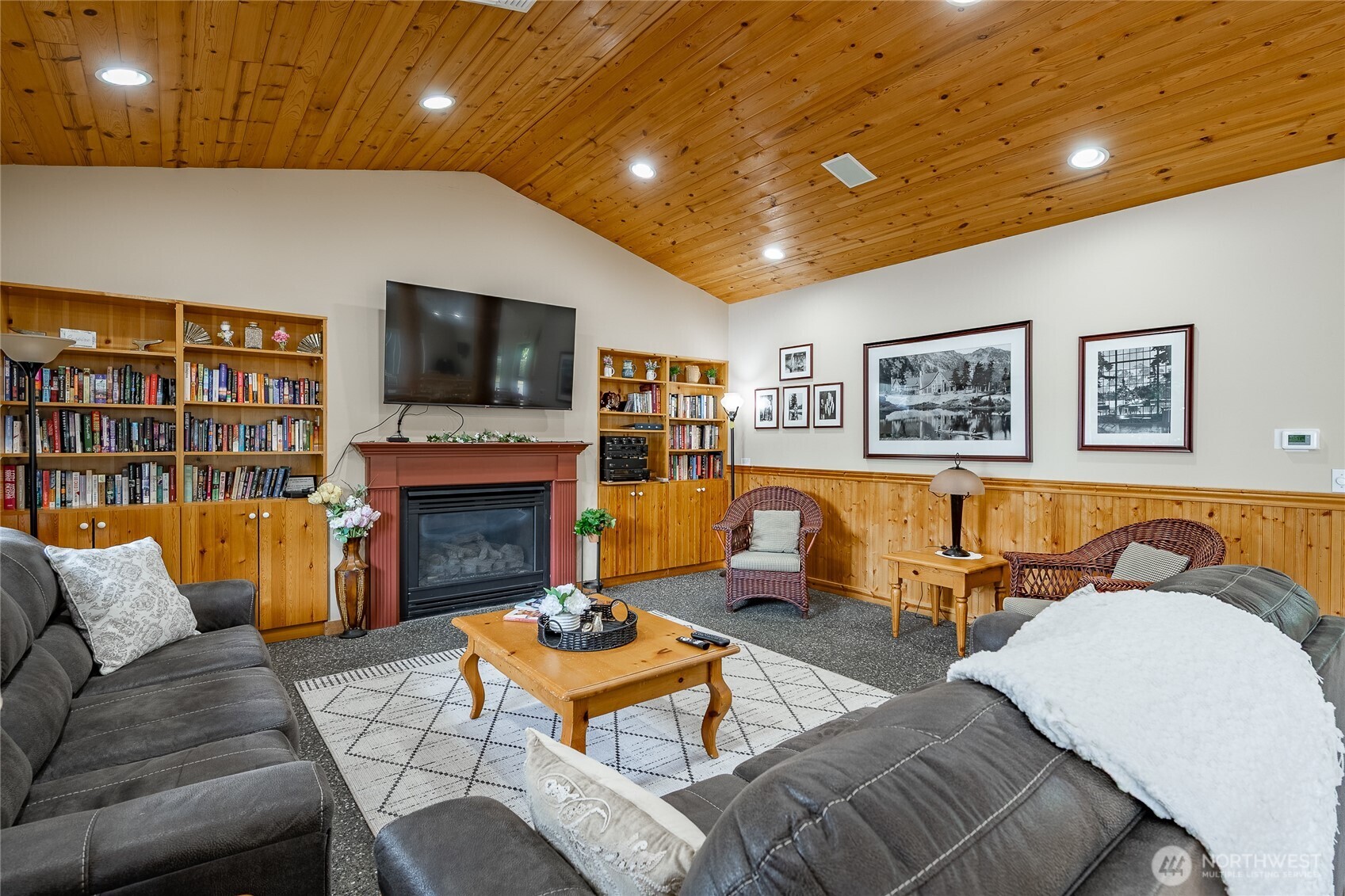 6350 Portal Way, Unit 83 Ferndale, WA 98248 - Photo 38 of 40 a living room with fireplace furniture and a flat screen tv
