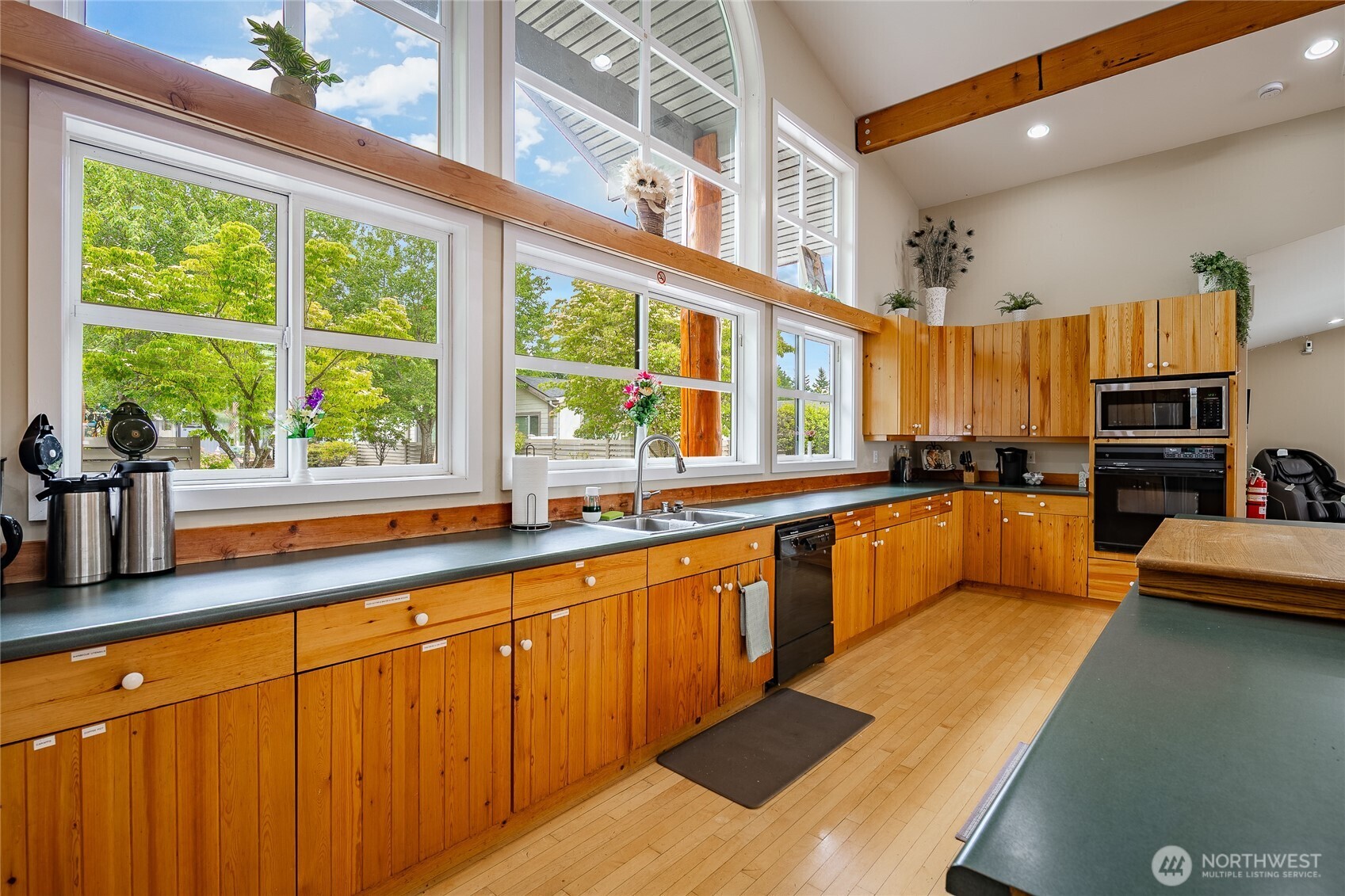 6350 Portal Way, Unit 83 Ferndale, WA 98248 - Photo 39 of 40 a large kitchen with lots of counter space and windows