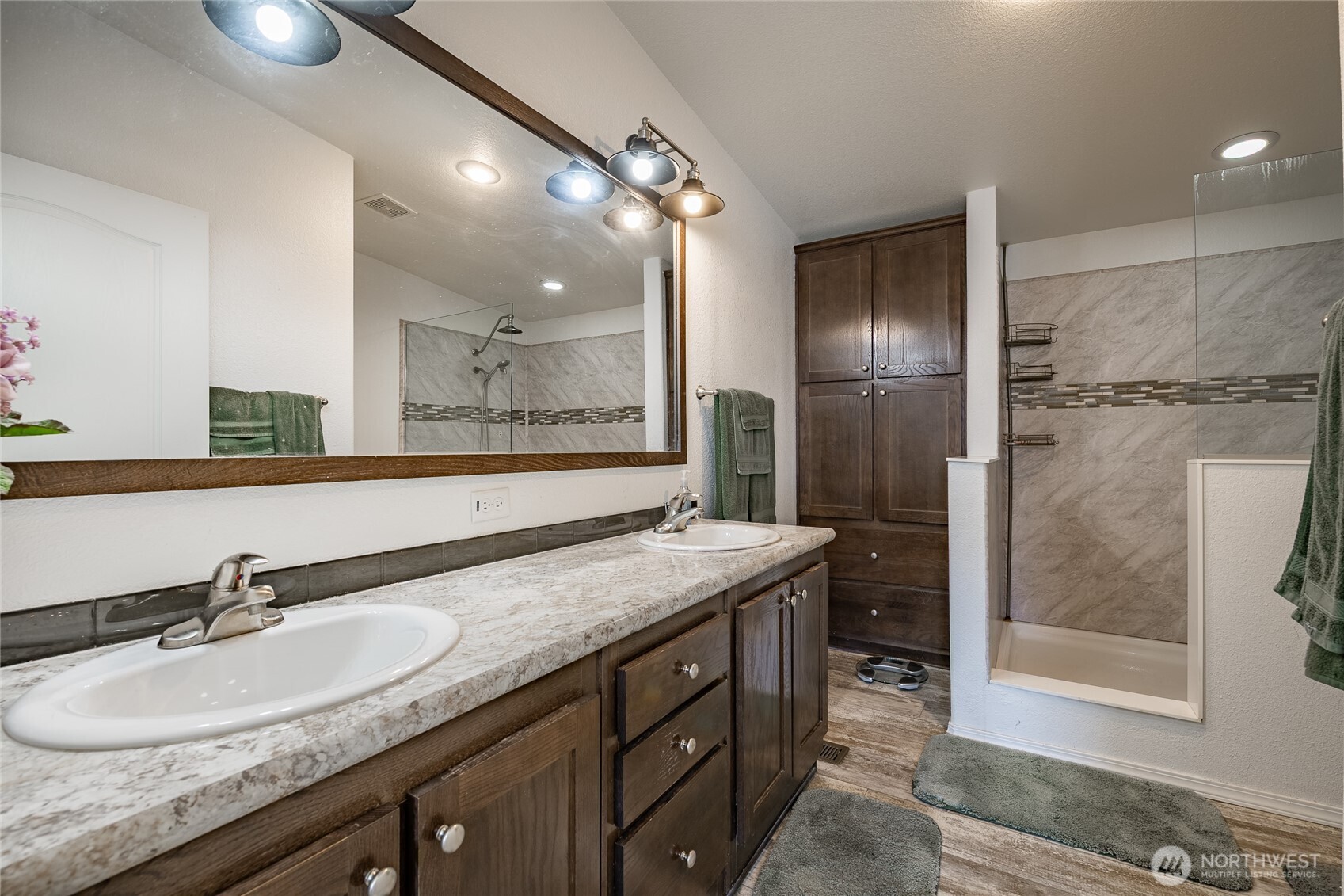 6350 Portal Way, Unit 83 Ferndale, WA 98248 - Photo 7 of 40 a bathroom with a granite countertop sink a mirror and a shower