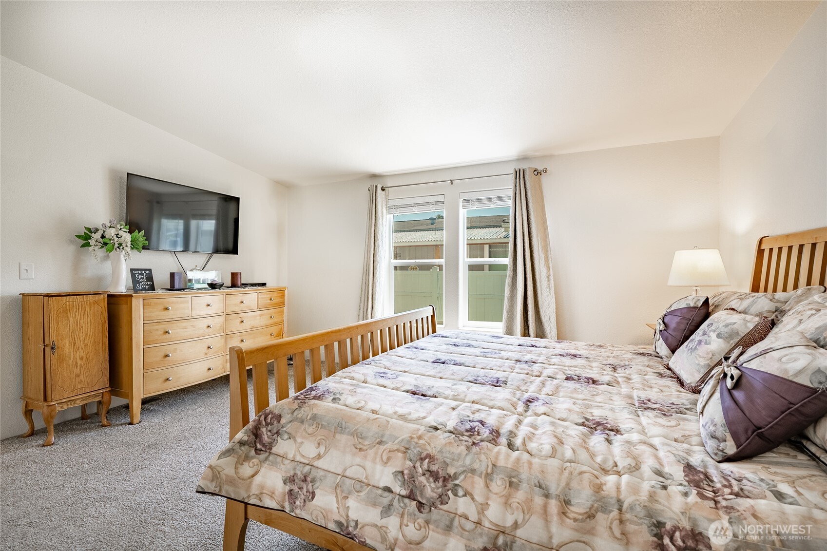 6350 Portal Way, Unit 83 Ferndale, WA 98248 - Photo 8 of 40 a bedroom with a bed and a dresser