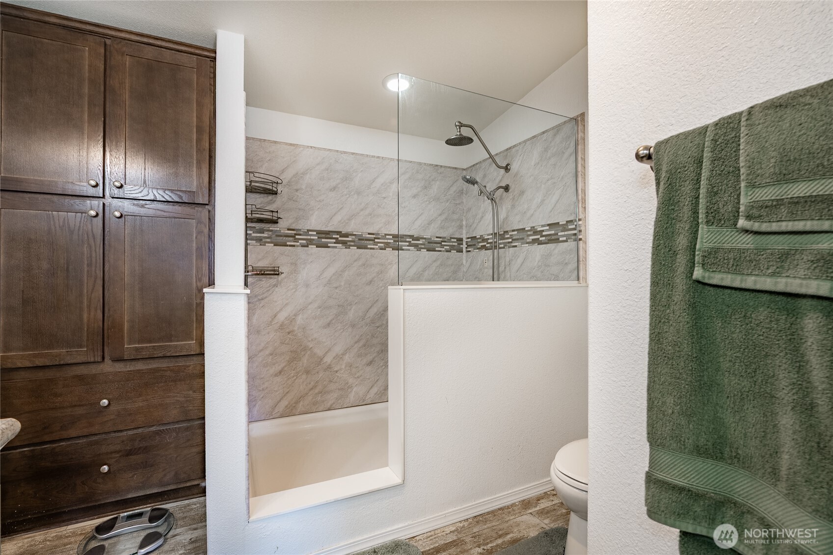 6350 Portal Way, Unit 83 Ferndale, WA 98248 - Photo 9 of 40 a bathroom with a glass shower door