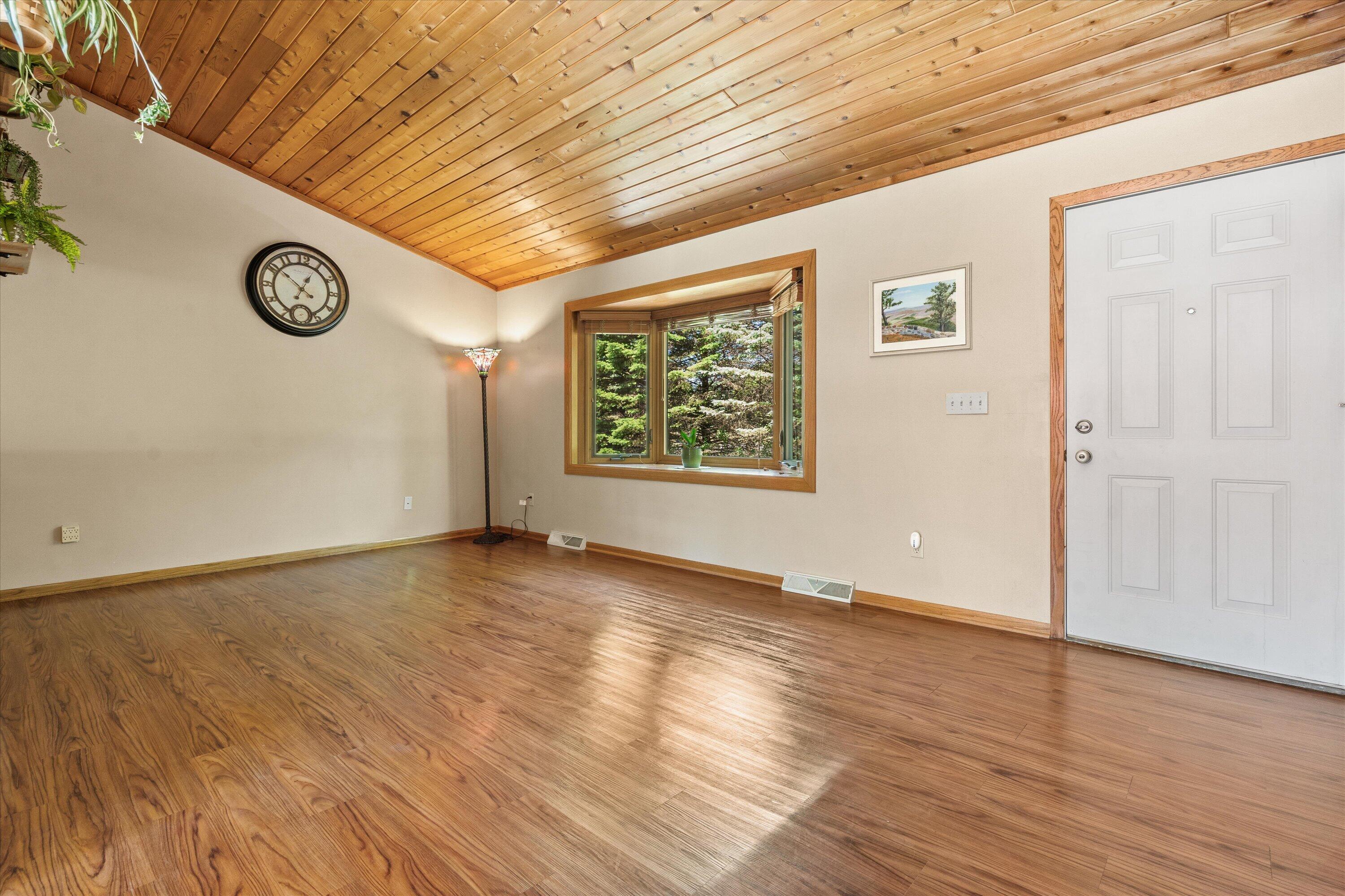 620 Prairie View Drive North Prairie, WI 53153 - Photo 17 of 52 Living Room Features Vaulted Ceiling & Large Bay Window
