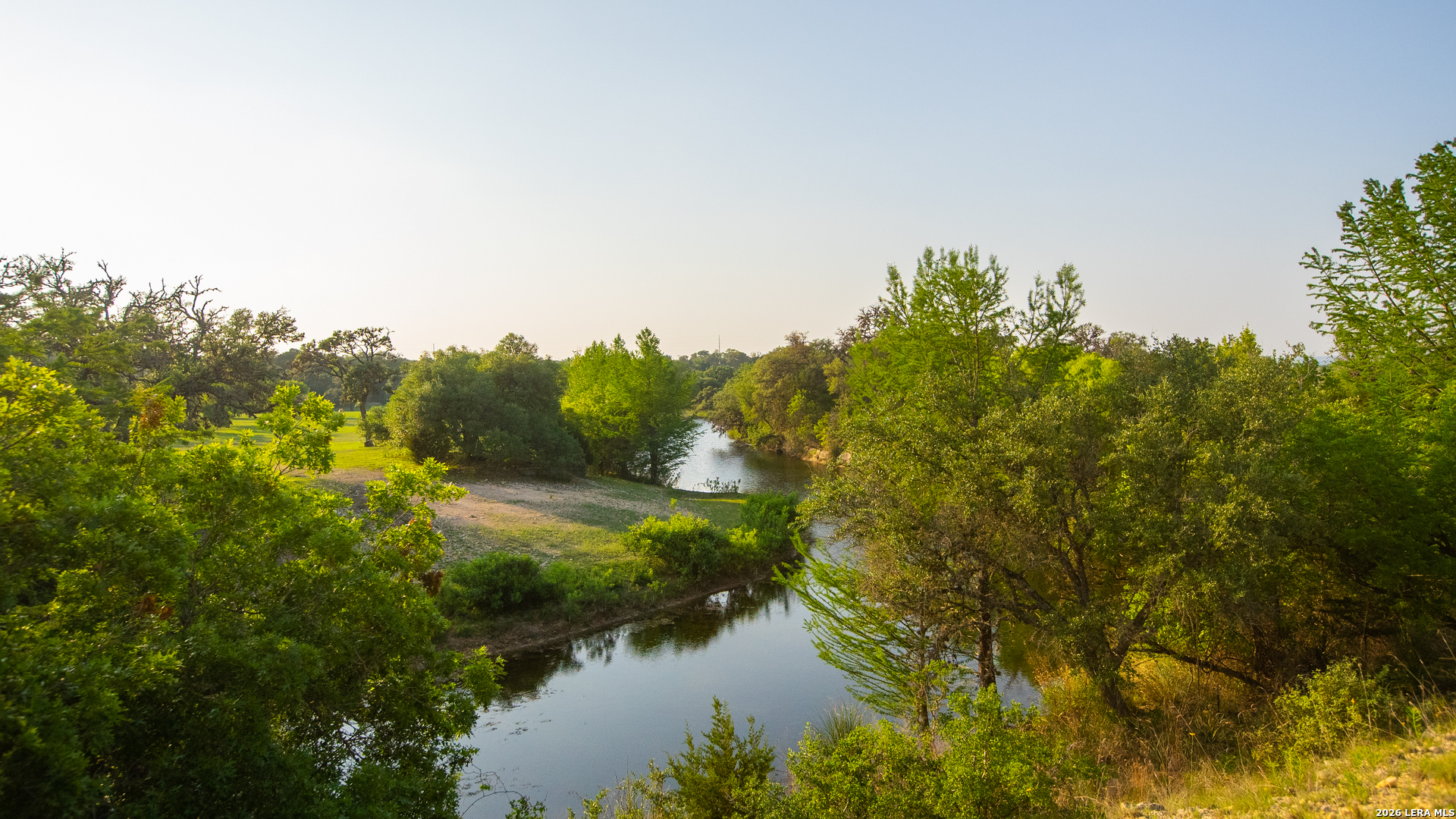 2991 Fm 470 Bandera, TX 78003 - Photo 2 of 46 a view of a lake with houses